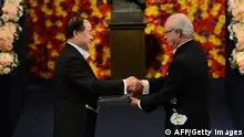 The 2012 Nobel Literature Prize winner Mo Yan of China (L) receives the Nobel Prize award from King Carl Gustaf of Sweden during an awarding ceremony on December 10, 2012 in Stockholm. The winners of the Nobel Prize 2012 in the categories of medicine, physics, chemistry, literature and economics receive their awards from the hands of Sweden's King Carl XVI Gustaf at a formal ceremony, followed by a gala banquet. AFP PHOTO/JONATHAN NACKSTRANDthe Nobel prize awarding ceremony on December 10, 2012 in Stockholm. The winners of the Nobel Prize 2012 in the categories of medicine, physics, chemistry, literature and economics receive their awards from the hands of Sweden's King Carl XVI Gustaf at a formal ceremony, followed by a gala banquet. AFP PHOTO/JONATHAN NACKSTRAND (Photo credit should read JONATHAN NACKSTRAND/AFP/Getty Images)