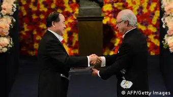 The 2012 Nobel Literature Prize winner Mo Yan of China (L) receives the Nobel Prize award from King Carl Gustaf of Sweden during an awarding ceremony on December 10, 2012 in Stockholm. The winners of the Nobel Prize 2012 in the categories of medicine, physics, chemistry, literature and economics receive their awards from the hands of Sweden's King Carl XVI Gustaf at a formal ceremony, followed by a gala banquet. AFP PHOTO/JONATHAN NACKSTRANDthe Nobel prize awarding ceremony on December 10, 2012 in Stockholm. The winners of the Nobel Prize 2012 in the categories of medicine, physics, chemistry, literature and economics receive their awards from the hands of Sweden's King Carl XVI Gustaf at a formal ceremony, followed by a gala banquet. AFP PHOTO/JONATHAN NACKSTRAND (Photo credit should read JONATHAN NACKSTRAND/AFP/Getty Images)