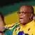 South African President Jacob Zuma sings during the opening ceremony of the 53rd National Conference of the African National Congress (ANC) on December 16, 2012, in Bloemfontein. South Africa's ruling ANC kicked off what promises to be a contentious five-yearly party conference today, with embattled President Jacob Zuma facing a leadership challenge from his deputy president Kgalema Motlanthe. The five day conference, which will go a long way toward deciding who will lead South Africa until the end of the decade. Motlanthe is hoping to wrest control of the party from Zuma. Should he succeed, the ANC's commanding electoral standing means he is almost certain to become the country's next president. AFP PHOTO / STEPHANE DE SAKUTIN (Photo credit should read STEPHANE DE SAKUTIN/AFP/Getty Images)