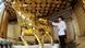 A staff polishes a gold ox statue using a ton of pure gold in Longxi International Hotel in Huaxi Village, Jiangyin, east Chinas Jiangsu Province, 6 October 2011. Huaxi village in east Chinas Jiangsu Province grabbed attention after completing a 328-meter high building that houses a statue of an ox made from a ton of gold. The village which has been dubbed as Chinas richest village spent more than 3 billion yuan (about 0.46 billion U.S. dollars) to build the 74-story building. The building opened as a hotel, named Longxi International Hotel, on October 8th to celebrate the 50th anniversary of the villages founding. Photo Yang Kejia A staff polishes a gold ox statue using a ton of pure gold in Longxi International Hotel in Huaxi Village, Jiangyin, east Chinas Jiangsu Province, 6 October 2011. Huaxi village in east Chinas Jiangsu Province grabbed attention after completing a 328-meter high building that houses a statue of an ox made from a ton of gold. The village which has been dubbed as Chinas richest village spent more than 3 billion yuan (about 0.46 billion U.S. dollars) to build the 74-story building. The building opened as a hotel, named Longxi International Hotel, on October 8th to celebrate the 50th anniversary of the villages founding. Photo Yang Kejia