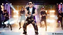 South Korean singer Psy performs his hit Gangnam Style during a morning television appearance in central Sydney in this October 17, 2012 file photo. Psy's infectious viral hit song, Gangnam Style, made history on December 21, 2012 as the first ever video on YouTube to reach 1 billion views, adding yet another record to the song's juggernaut journey into mainstream pop. Picture taken October 17, 2012. REUTERS/Tim Wimborne/Files (AUSTRALIA - Tags: ENTERTAINMENT)