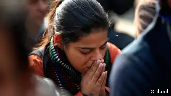 A woman cries while attending a gathering of people who came together to mourn the death of the 23-year-old gang rape victim in New Delhi, India, Saturday, Dec. 29, 2012. The young Indian woman who was gang-raped and severely beaten on a bus in New Delhi died Saturday at a Singapore hospital, after her ordeal galvanized Indians to demand greater protection for women from sexual violence that impacts thousands of them every day. (AP Photo/ Saurabh Das)