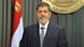 Egypt's President Mohamed Mursi speaks to the nation after signing Egypt's new constitution in Cairo December 26, 2012, in this handout photo released by Egyptian Presidency office. Mursi signed into law a new constitution shaped by his Islamist allies, a bitterly contested document which he said would help end political turmoil and allow him to focus on fixing the economy. REUTERS/Egyptian Presidency/Handout (EGYPT - Tags: POLITICS ELECTIONS) FOR EDITORIAL USE ONLY. NOT FOR SALE FOR MARKETING OR ADVERTISING CAMPAIGNS. THIS IMAGE HAS BEEN SUPPLIED BY A THIRD PARTY. IT IS DISTRIBUTED, EXACTLY AS RECEIVED BY REUTERS, AS A SERVICE TO CLIENTS Egypt's President Mohamed Mursi speaks to the nation after signing Egypt's new constitution in Cairo December 26, 2012, in this handout photo released by Egyptian Presidency office. Mursi signed into law a new constitution shaped by his Islamist allies, a bitterly contested document which he said would help end political turmoil and allow him to focus on fixing the economy. REUTERS/Egyptian Presidency/Handout (EGYPT - Tags: POLITICS ELECTIONS) FOR EDITORIAL USE ONLY. NOT FOR SALE FOR MARKETING OR ADVERTISING CAMPAIGNS. THIS IMAGE HAS BEEN SUPPLIED BY A THIRD PARTY. IT IS DISTRIBUTED, EXACTLY AS RECEIVED BY REUTERS, AS A SERVICE TO CLIENTS