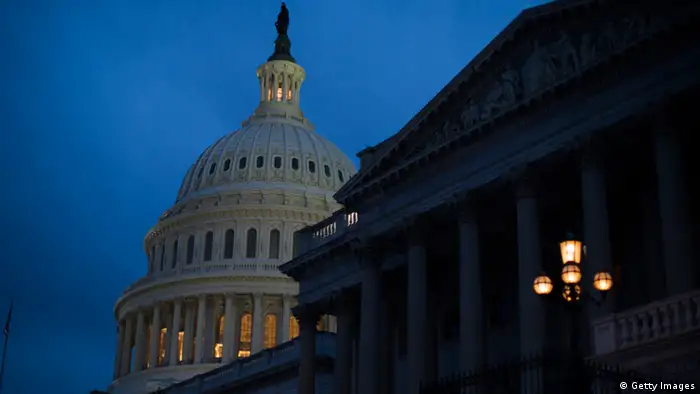 WASHINGTON, DC - DECEMBER 31: The U.S. Capitol illuminates at dusk on Capitol Hill on December 31, 2012 in Washington, DC. The House and Senate are both still in session on New Year's Eve to try to deal with the looming 'fiscal cliff' issue. (Photo by Drew Angerer/Getty Images)