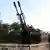 Free Syrian Army fighters with artillery near the airbase (Photo: REUTERS/Abdalghne Karoof)