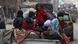 Syrian children sit on the back of a truck in Aleppo January 2, 2013. REUTERS/Muzaffar Salman (SYRIA - Tags: CONFLICT) Syrian children sit on the back of a truck in Aleppo January 2, 2013. REUTERS/Muzaffar Salman (SYRIA - Tags: CONFLICT)