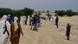 In this Sunday, Sept. 16, 2012 photo, armed fighters from Islamist group Ansar Dine stand guard between onlookers and the area where Ansar Dine was preparing to amputate the hand of a young man found guilty of stealing rice, in Timbuktu, Mali. In a report launched Thursday, Sept. 20, 2012, Amnesty International says it has documented 'horrific abuses' against civilians in Islamist-controlled northern Mali, including the recruitment of child soldiers, sexual violence, extra-judicial executions, and seven amputations just since August. (Foto:AP/dapd) In this Sunday, Sept. 16, 2012 photo, armed fighters from Islamist group Ansar Dine stand guard between onlookers and the area where Ansar Dine was preparing to amputate the hand of a young man found guilty of stealing rice, in Timbuktu, Mali. In a report launched Thursday, Sept. 20, 2012, Amnesty International says it has documented 'horrific abuses' against civilians in Islamist-controlled northern Mali, including the recruitment of child soldiers, sexual violence, extra-judicial executions, and seven amputations just since August. (Foto:AP/dapd)