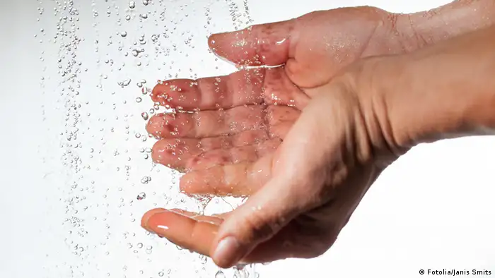 Close-up picture of water flowing into hands (Photo: Janis Smits)