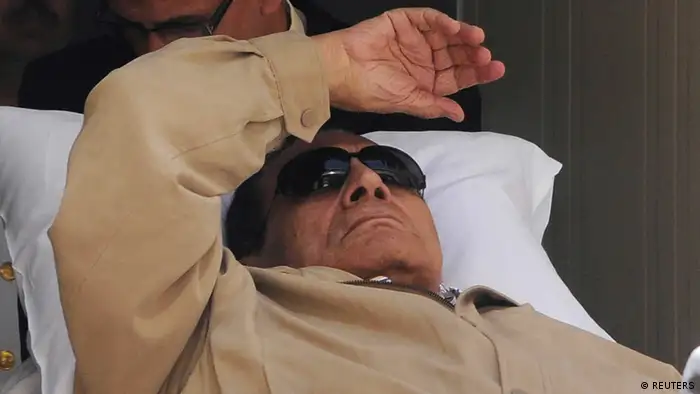 Former Egyptian President Hosni Mubarak is wheeled out of a courtroom after his trial in Cairo in this June 2, 2012 file photo. Egypt's Appeals Court accepted an appeal by Mubarak and his former interior minister on January 13, 2013, allowing him to be retried over the killing of protesters in the 2011 uprising. REUTERS/Stringer/Files (EGYPT - Tags: POLITICS CRIME LAW)