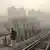 This picture taken on January 12, 2013 shows a Chinese man walking along a railway track in Beijing. Dense smog shrouded Beijing on January 12, with pollution at hazardous levels for a second day and residents advised to stay indoors, state media said. AFP PHOTO / WANG ZHAO (Photo credit should read WANG ZHAO/AFP/Getty Images)