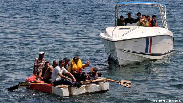 Cuban coastguards help 'balseros' from a rustic craft getting on board the boat, in Havana, Cuba, 4 June 2009 in an intent to stop an illegal exit from the island. EPA/ALEJANDRO ERNESTO +++(c) dpa - Bildfunk+++