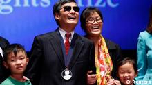 Chinese dissident Chen Guangcheng, his wife Yuan Weijing and their children appear onstage after Chen received The Tom Lantos Human Rights Prize in the Capitol in Washington January 29, 2013. REUTERS/Kevin Lamarque (UNITED STATES - Tags: POLITICS TPX IMAGES OF THE DAY)