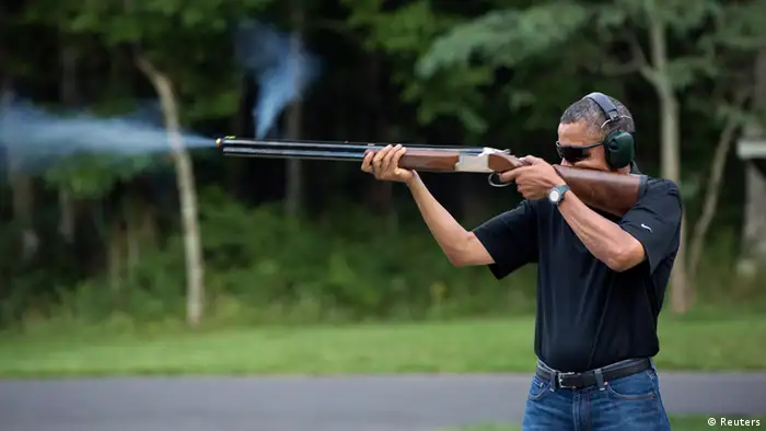 President Barack Obama shoots clay targets on the range at Camp David, Maryland, in this White House handout photo taken August 4, 2012. REUTERS/White House/Pete Souza/Handout (UNITED STATES - Tags: POLITICS TPX IMAGES OF THE DAY) FOR EDITORIAL USE ONLY. NOT FOR SALE FOR MARKETING OR ADVERTISING CAMPAIGNS. THIS IMAGE HAS BEEN SUPPLIED BY A THIRD PARTY. IT IS DISTRIBUTED, EXACTLY AS RECEIVED BY REUTERS, AS A SERVICE TO CLIENTS