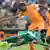 RUSTENBURG, SOUTH AFRICA - FEBRUARY 03: Ogenyi Onazi of Nigeria and Didier Drogba of Ivory Coast compete during the 2013 Orange African Cup of Nations 3rd Quarter Final match between Ivory Coast and Nigeria, at Royal Bafokeng Stadium on February 03, 2013 in Rustenburg, South Africa. (Photo by Lefty Shivambu/Gallo Images/Getty Images)