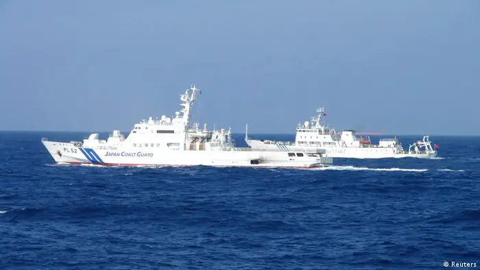 Chinese marine surveillance ship Haijian No. 51 (R) cruises next to a Japan Coast Guard patrol ship, Akaishi, in the East China Sea near the disputed isles known as Senkaku isles in Japan and Diaoyu islands in China, in this handout photo released by the 11th Regional Coast Guard Headquarters-Japan Coast Guard February 4, 2013. Two Chinese maritime surveillance vessels entered Japan's territorial waters on Monday around the disputed isles in the East China Sea, Kyodo News reported. Mandatory Credit REUTERS/11th Regional Coast Guard Headquarters-Japan Coast Guard/Handout (JAPAN - Tags: POLITICS) ATTENTION EDITORS - THIS IMAGE WAS PROVIDED BY A THIRD PARTY. FOR EDITORIAL USE ONLY. NOT FOR SALE FOR MARKETING OR ADVERTISING CAMPAIGNS. THIS PICTURE IS DISTRIBUTED EXACTLY AS RECEIVED BY REUTERS, AS A SERVICE TO CLIENTS. MANDATORY CREDIT