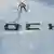 Лыжник в прыжке над надписью "Сочи"