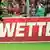 Aufschrift "Wetten" auf einer Werbebande in einem Fußballstadion (Foto: Patrick Seeger dpa/lsw)