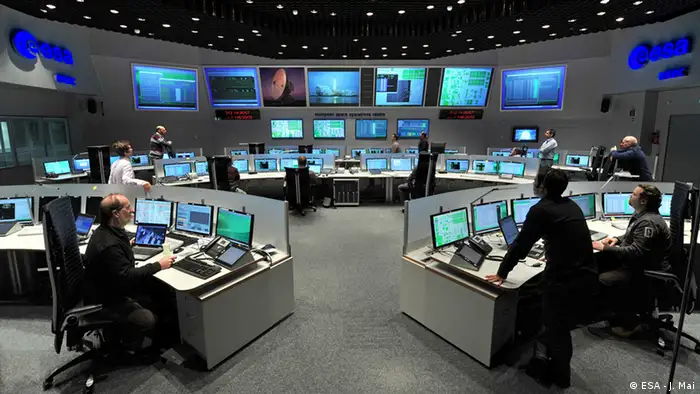 Title ESOC control room Released 17/05/2012 3:32 pm Copyright ESA - J. Mai Description ESOC serves as the Operations Control Centre for ESA missions, and hosts our Main Control Room (shown here), combined Dedicated Control Rooms for specific missions and the ESTRACK Control Centre - which manages our worldwide ground tracking stations. ESOC also hosts facilities for satellite communications, navigation, networks and other special functions.