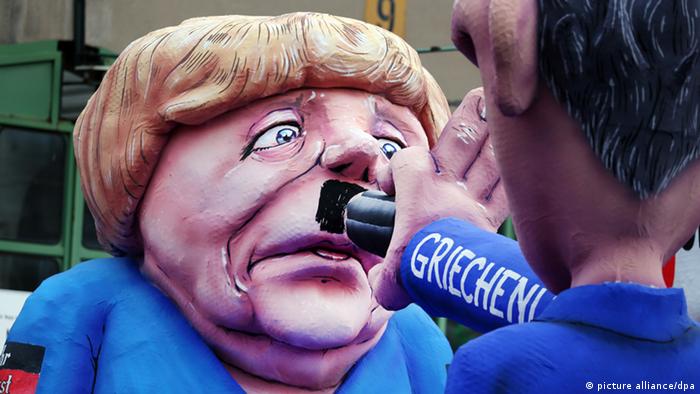 Eine Karikatur von Bundeskanzlerin Angela Merkel auf einem Karnevalswagen