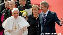 FILE - Pope Benedict XVI (front, left) arrives at Tegel airport in Berlin, Germany, 22 September 2011. The Pope was welcomed by German Chancellor Angela Merkel (second right) and then German President Christian Wulff (r). The head of the Roman Catholic Church visited Germany 22-25 September 2011. Foto: Robert Schlesinger dpa/lbn (zu dpa:Ein Jahr nach dem Papstbesuch: Außer Spesen nichts gewesen?) +++(c) dpa - Bildfunk+++