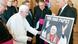 FREIBURG IM BREISGAU, GERMANY - SEPTEMBER 25: In this photo provided by the German Government Press Office a representative of German telecoms provider Deutsche Telekom hands over an artwork made out of over 10000 small pictures to Pope Benedict XVI on September 25, 2011 in Freiburg im Breisgau, Germany. The Pope is winding up a four-day visit to Germany that included a private meeting with victims of sexual abuse by Catholic priests as well as an ecumenical mass with representatives of the Protestant Church in Germany. (Photo by Guido Bergmann/Bundesregierung-Pool via Getty Images) Papst Benedikt XVI. erhält von einem Vertreter der Deutschen Telekom (unbekannt), einer der Donatoren des Papstbesuchs, ein Grafik aus über 10000 Bildern, die eine Schlagzeile zur Papstwahl 2005 zeigt. Foto: Pool / Bundesregierung / Bergmann FREIBURG IM BREISGAU, GERMANY - SEPTEMBER 25: In this photo provided by the German Government Press Office a representative of German telecoms provider Deutsche Telekom hands over an artwork made out of over 10000 small pictures to Pope Benedict XVI on September 25, 2011 in Freiburg im Breisgau, Germany. The Pope is winding up a four-day visit to Germany that included a private meeting with victims of sexual abuse by Catholic priests as well as an ecumenical mass with representatives of the Protestant Church in Germany. (Photo by Guido Bergmann/Bundesregierung-Pool via Getty Images) Papst Benedikt XVI. erhält von einem Vertreter der Deutschen Telekom (unbekannt), einer der Donatoren des Papstbesuchs, ein Grafik aus über 10000 Bildern, die eine Schlagzeile zur Papstwahl 2005 zeigt. Foto: Pool / Bundesregierung / Bergmann