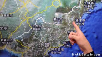 GettyImages 161502978 Chen Kuo-chang, a senior technical specialist from Taiwan's Seismology Center points towards a North Korean map at the location that North Korea staged a nuclear test, at the Central Weather Bureau in Taipei on February 12, 2013. North Korea staged an apparent nuclear test of six to seven kilotons in a striking act of defiance that, if confirmed, is sure to trigger global condemnation from enemies and allies alike. AFP PHOTO / Sam Yeh (Photo credit should read SAM YEH/AFP/Getty Images)