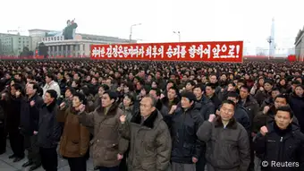 North Koreans attend a rally celebrating the country's third nuclear test at the Kim Il-Sung square in Pyongyang February 14, 2013 in this picture taken and released by the North's official KCNA news agency. North Korea conducted nuclear test on Tuesday. Korean characters read,Go forward for the last victory along with great comrade Kim Jong-Un!. REUTERS/KCNA (NORTH KOREA - Tags: POLITICS MILITARY) ATTENTION EDITORS - THIS PICTURE WAS PROVIDED BY A THIRD PARTY. REUTERS IS UNABLE TO INDEPENDENTLY VERIFY THE AUTHENTICITY, CONTENT, LOCATION OR DATE OF THIS IMAGE. FOR EDITORIAL USE ONLY. NOT FOR SALE FOR MARKETING OR ADVERTISING CAMPAIGNS. THIS PICTURE IS DISTRIBUTED EXACTLY AS RECEIVED BY REUTERS, AS A SERVICE TO CLIENTS. QUALITY FROM SOURCE. NO THIRD PARTY SALES