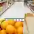 Grocery cart loaded with fresh fruit and bread moving through the aisle. #2583402 Barbara Helgason - Fotolia.com 2007