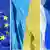 Photomontage with a flag each from EU, Ukraine and Russia