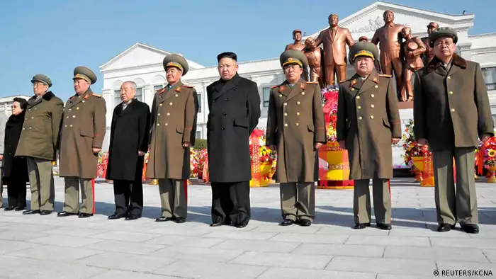 North Korean leader Kim Jong-Un (4th R) and officials attend a wreath laying ceremony in front of a statue of North's founder Kim Il-Sung and his son and late leader Kim Jong-Il at the Mangyongdae Revolutionary School in Pyongyang on the occasion of birth anniversary of the late leader Kim Jong-Il, which falls on Saturday, in this undated recent picture released by the North's official KCNA news agency on February 16, 2013. REUTERS/KCNA (NORTH KOREA - Tags: POLITICS MILITARY) ATTENTION EDITORS - THIS PICTURE WAS PROVIDED BY A THIRD PARTY. REUTERS IS UNABLE TO INDEPENDENTLY VERIFY THE AUTHENTICITY, CONTENT, LOCATION OR DATE OF THIS IMAGE. THIS PICTURE IS DISTRIBUTED EXACTLY AS RECEIVED BY REUTERS, AS A SERVICE TO CLIENTS. QUALITY FROM SOURCE. NO THIRD PARTY SALES. NOT FOR USE BY REUTERS THIRD PARTY DISTRIBUTORS