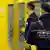 Mitarbeiter eines Sicherheitsdiensts führen eine Kontrolle in der Berliner U-Bahn durch.