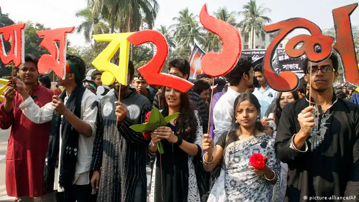 Bangladeshis hold letters of the Bangla language while participating in a rally to mark International Mother Language Day in Dhaka, Bangladesh, Thursday, Feb. 21, 2013. International Mother Language Day is observed in commemoration of the movement where a number of students died in 1952, defending the recognition of Bangla as a state language of the former East Pakistan, now Bangladesh. The day is now observed across the world to promote linguistic and cultural diversity and multilingualism. The letters read 'Immortal Feb. 21, we pay homage to language martyrs. (AP Photo/Pavel Rahman)