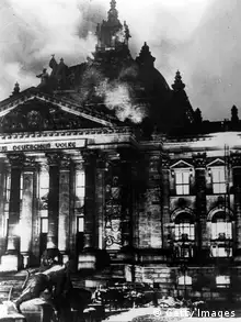 GettyImages 2658536 The Reichstag in flames during the Nazi ascent to power in Berlin. (Photo by Fox Photos/Getty Images)