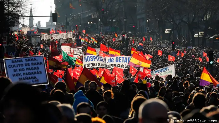 Public workers, small political parties and non-profit organisations stage a protest against government austerity on February 23, 2013 in Madrid. Nurses, doctors, students, miners and members of Spain's indignant movement against economic inequality join in the so-called citizens' tide against the steep spending cuts and tax hikes imposed by Prime Minister Mariano Rajoy's conservative government to slash the public deficit. The day of protest coincides with the 31st anniversary of the failure of right-wing military coup that sought to crush Spain's young democracy and restore military rule. AFP PHOTO / CESAR MANSO (Photo credit should read CESAR MANSO/AFP/Getty Images)