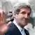 U.S. Secretary of State John Kerry waves as he leaves Number 10 Downing Street in London February 25, 2013. REUTERS/Suzanne Plunkett (BRITAIN - Tags: POLITICS)