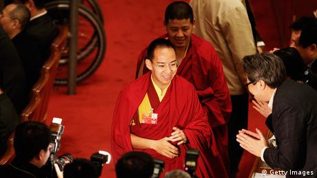 The Panchen Lama (C), the second highest Tibetan Buddhist leader, arrives the closing session of the National Committee of the Chinese People's Political Consultative Conference (CPPCC) at the Great Hall of the People on March 13, 2012 in Beijing, China. Known as 'liang hui,' or 'two organizations', it consists of meetings of China's legislature, the National People's Congress (NPC), and its advisory auxiliary, the Chinese People's Political Consultative Conference (CPPCC). (Photo by Lintao Zhang/Getty Images) 