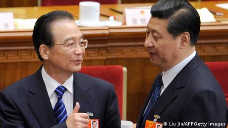 Chinese Premier Wen Jiabao (L) talks with Vice President Xi Jinping (R) after the fourth plenary meeting of the National People's Congress's (NPC) annual session at the Great Hall of the People in Beijing on March 11, 2012. Proposed changes to China's criminal law being debated this week by the parliament originally included a clause that allowed police to hold people suspected of terrorism or endangering national security in secret locations without notifying their families. AFP PHOTO / LIU JIN (Photo credit should read LIU JIN/AFP/Getty Images) 