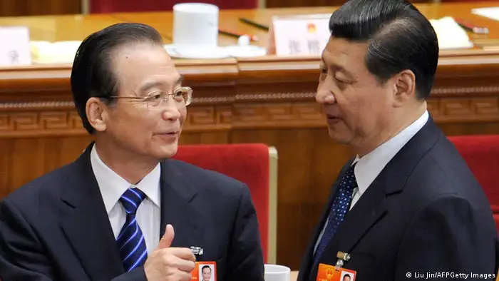 Chinese Premier Wen Jiabao (L) talks with Vice President Xi Jinping (R) after the fourth plenary meeting of the National People's Congress's (NPC) annual session at the Great Hall of the People in Beijing on March 11, 2012. Proposed changes to China's criminal law being debated this week by the parliament originally included a clause that allowed police to hold people suspected of terrorism or endangering national security in secret locations without notifying their families. AFP PHOTO / LIU JIN (Photo credit should read LIU JIN/AFP/Getty Images)