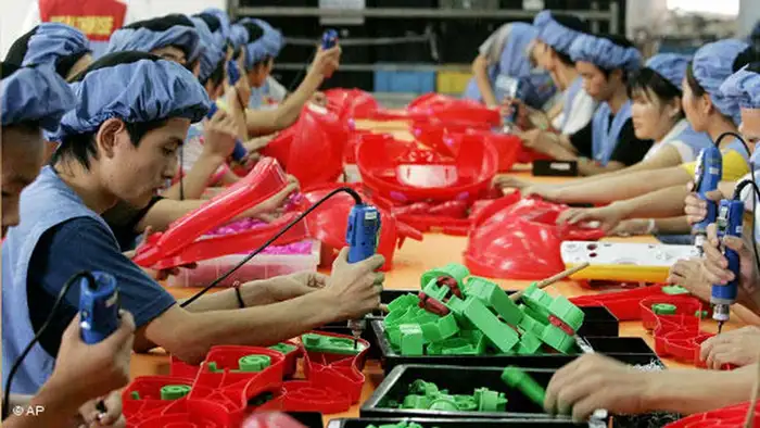 FILE - In this Sept. 4, 2007 file photo, workers assemble toys at the production line of Dongguan Da Lang Wealthwise Plastic Factory in Dongguan, China A reader-submitted question about what happens to recalled Chinese-made products, is being answered as part of an Associated Press Q&A column called Ask AP. (AP Photo/Eugene Hoshiko, File)