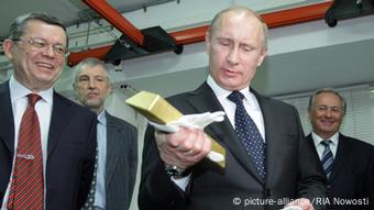 Vladimir Putin with a bar of gold