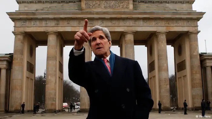 U.S. Secretary of State John Kerry gestures as he stands in front of the Brandenburg Gate in Berlin February 26, 2013. Kerry arrived in Berlin on Monday, a stop on a nine-nation, 11-day trip that will also take him to Paris, Rome, Ankara, Cairo, Riyadh, Abu Dhabi and Doha before he returns home on March 6. REUTERS/Fabrizio Bensch (GERMANY - Tags: POLITICS TPX IMAGES OF THE DAY)