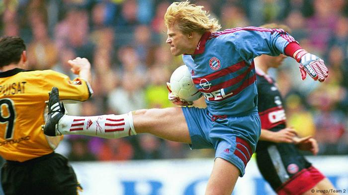 Oliver Kahn kicks at Stephane Chapuisat with the studs showing.
