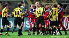 Borussia Dortmund and Bayern Munich players gather together. 