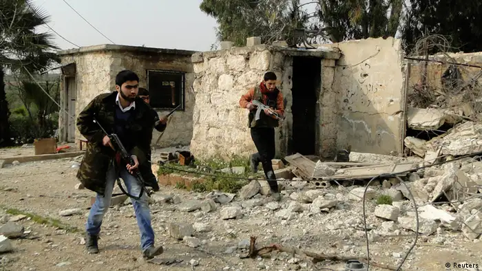 Free Syrian Army fighters carry their weapons and deploy after they seized control of regime's 80th Brigade's base near Aleppo International Airport, February 23, 2013. Picture taken February 23, 2013. REUTERS/Mahmoud Hassano (SYRIA - Tags: POLITICS CIVIL UNREST)