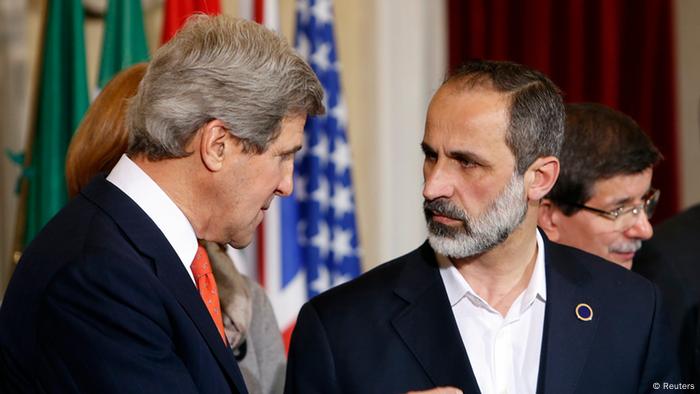 U.S. Secretary of State John Kerry (L) talks with New Syrian National Coalition head Mouaz al-Khatib during a meeting at Villa Madama in Rome, February 28, 2013. REUTERS/Remo Casilli (ITALY - Tags: POLITICS)