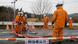 With a "No Entry" sign, workers wearing protective gear conduct a decontamination operation at the entrance of the Joban Expressway in Tomioka, Fukushima prefecture, Friday, March 1, 2013 inside the radiated no-go zone surrounding the Fukushima Dai-ichi nuclear power plant. On Monday, March 11, Japan observes two years from 2011 tsunami and earthquake that caused the worst nuclear disaster since Chernobyl. (AP Photo/Shizuo Kambayashi) pixel With a "No Entry" sign, workers wearing protective gear conduct a decontamination operation at the entrance of the Joban Expressway in Tomioka, Fukushima prefecture, Friday, March 1, 2013 inside the radiated no-go zone surrounding the Fukushima Dai-ichi nuclear power plant. On Monday, March 11, Japan observes two years from 2011 tsunami and earthquake that caused the worst nuclear disaster since Chernobyl. (AP Photo/Shizuo Kambayashi) pixel