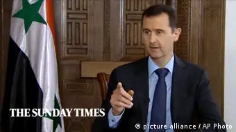 ***ACHTUNG: Bild nur zur zeitnahen (24 Stunden) Berichterstattung über das Interview verwenden!!!*** In this image taken from video filmed on Thursday, Feb. 28, 2013 and released Saturday evening, March 2, 2013, Syrian President Bashar Assad speaks during an interview with the Sunday Times, in Damascus, Syria. Iran and Syria condemned a U.S. plan to assist rebels fighting to topple Assad on Saturday and signaled the Syrian leader intends to stay in power at least until 2014 presidential elections. Assad told the Sunday Times in the interview timed to coincide with U.S. Secretary of State John Kerry's first foreign trip that the intelligence, communication and financial assistance being provided is very lethal. Kerry announced on Thursday that the Obama administration was giving an additional $60 million in assistance to Syria's political opposition and would, for the first time, provide non-lethal aid directly to the rebels. (AP Photo/Sunday Times via AP video) THIS IMAGE IS FOR USE FOR 24 HOUR NEWS ACCESS ONLY, SUNDAY TIMES LOGO MUST NOT BE OBSCURED, NO ARCHIVES, NO SALES /PLEASE CONTACT SUNDAY TIMES SYNDICATION DEPARTMENT BY EMAIL TO ENQUIRIES@NISYNDICATION.COM FOR QUESTIONS REGARDING USE OUTSIDE THE 24 HOUR NEWS ACCESS WINDOW