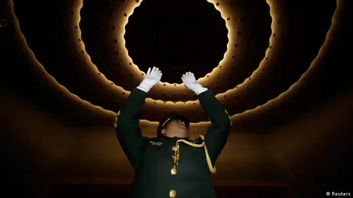 The conductor of a military band performs during a rehearsal before the opening ceremony of the National People's Congress (NPC) at the Great Hall of the People in Beijing, March 3, 2013. REUTERS/Jason Lee (CHINA - Tags: POLITICS)