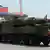 A military vehicle carries what is believed to be a Taepodong-class missile Intermediary Range Ballistic Missile (IRBM), about 20 meters long, during a military parade to mark the 100 birth of the country's founder Kim Il-Sung in Pyongyang on April 15, 2012. The commemorations came just two days after a satellite launch timed to mark the centenary fizzled out embarrassingly when the rocket apparently exploded within minutes of blastoff and plunged into the sea. AFP PHOTO / PEDRO UGARTE (Photo credit should read PEDRO UGARTE/AFP/Getty Images)