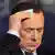 Italy's former Prime Minister Silvio Berlusconi wipes his face on a television show in Rome in this February 20, 2013 file photo. An Italian court on March 7, 2013 sentenced Berlusconi to a one-year jail term for making public the taped contents of a confidential phone call in a case related to a 2005 banking scandal. REUTERS/Remo Casilli/Files (ITALY - Tags: POLITICS MEDIA CRIME LAW)